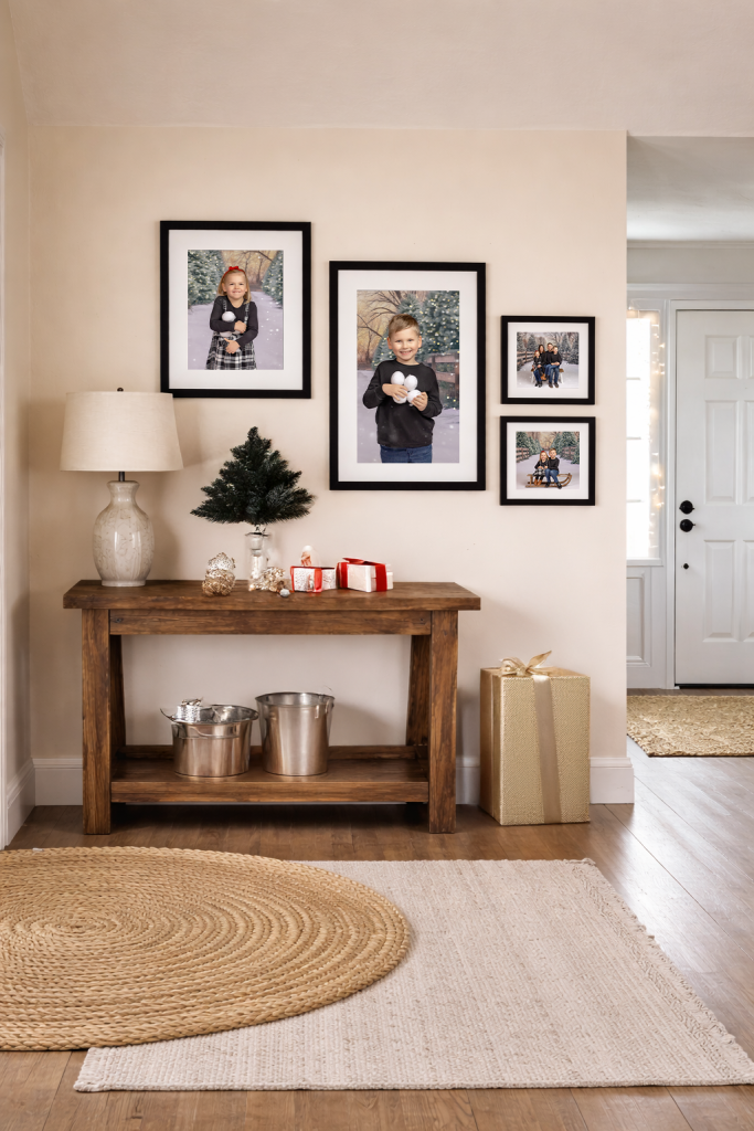 Christmas photos hung in entrance way