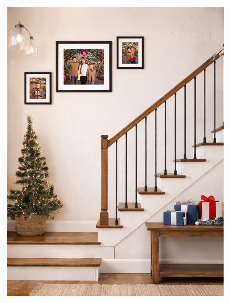 Christmas family photos framed over stairway
