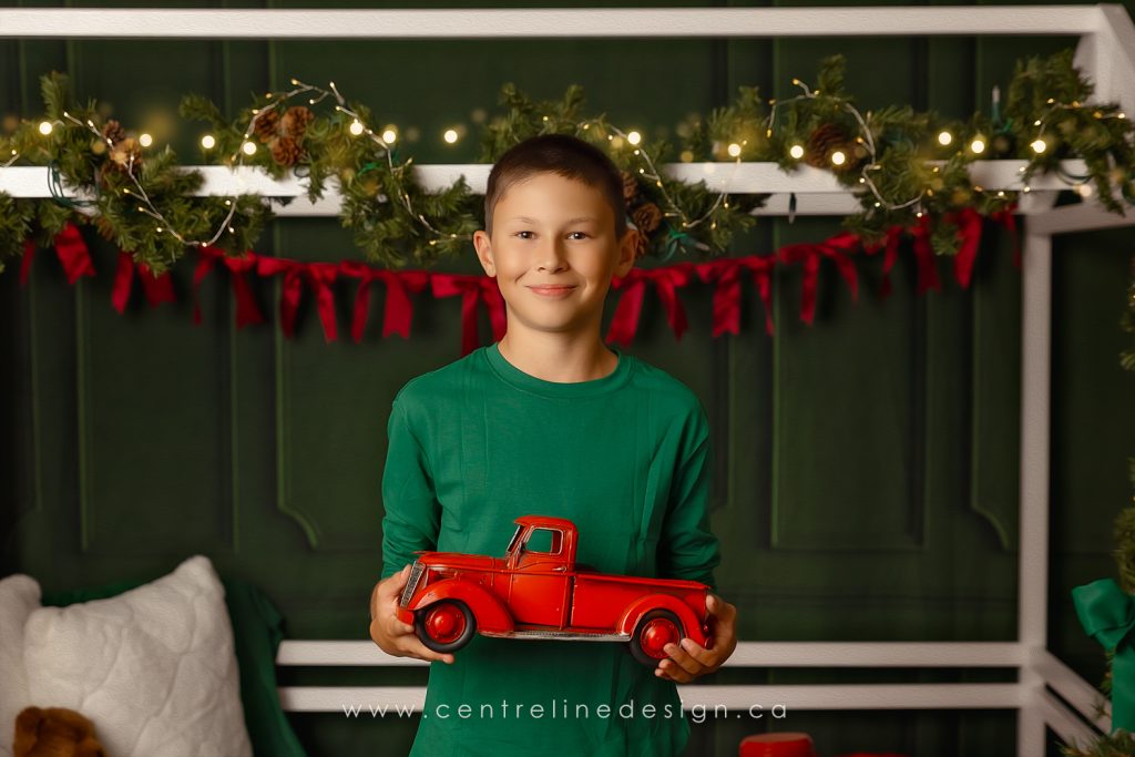 WEB-ChristmasMegan2026-11 Christmas Mini boy holding toy truck