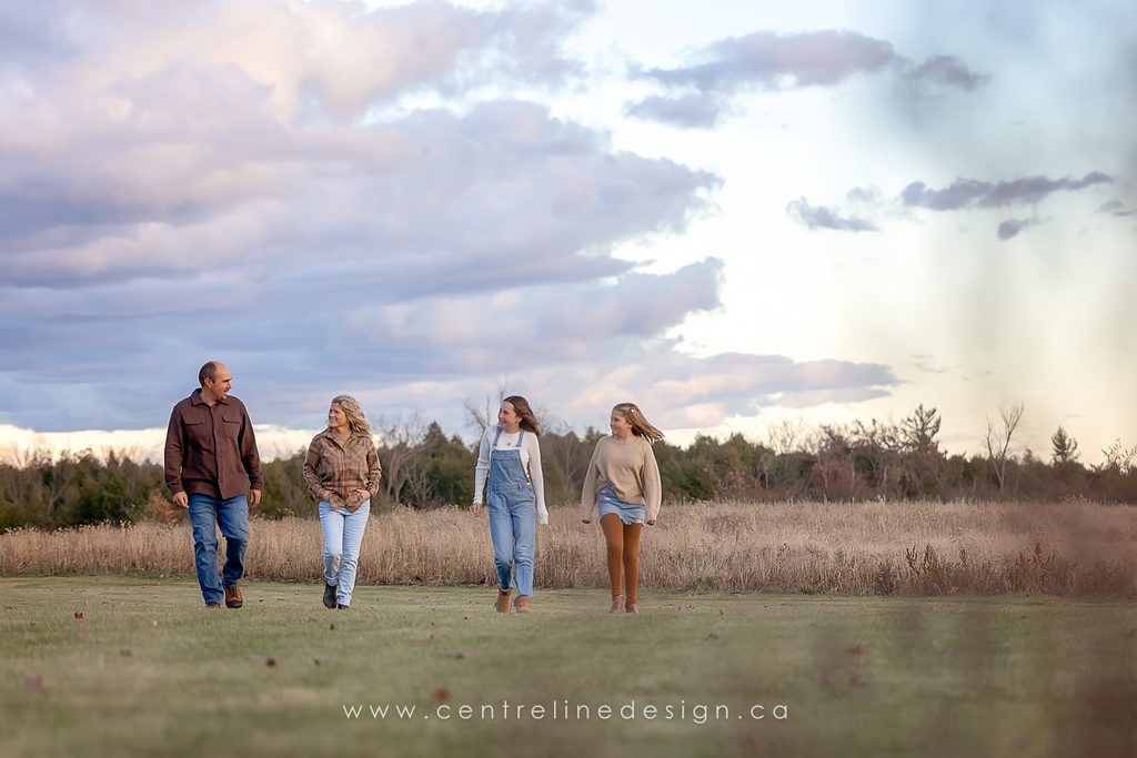 Family wearing cream, olive and brown outfits during a fall photography session in Kawartha Lakes.
