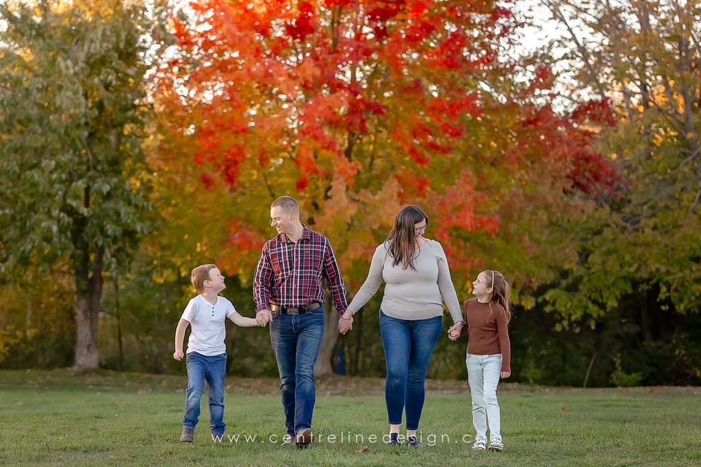 Family wearing cream, olive and rust outfits during a fall photography session in Kawartha Lakes.